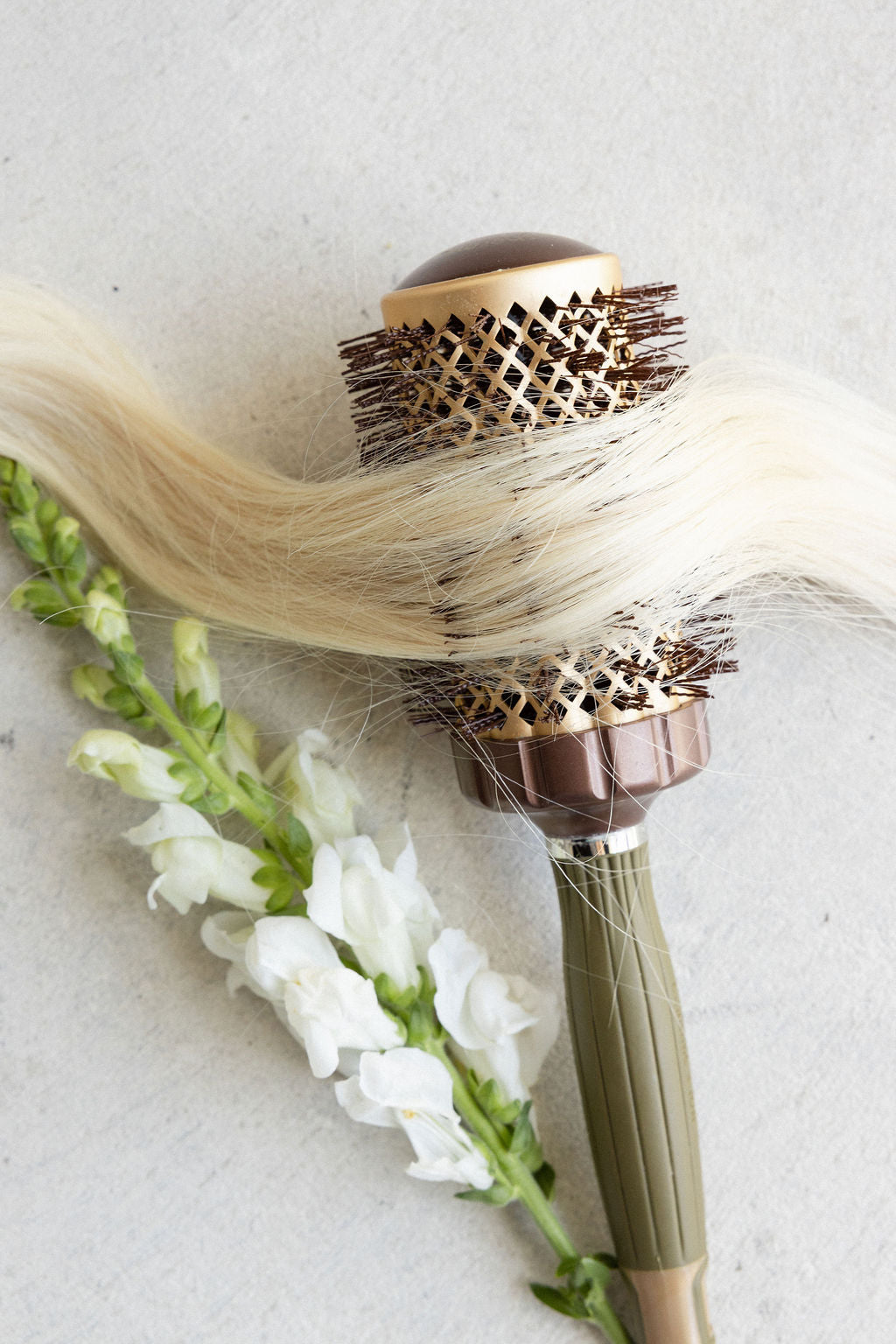 A gilded cart hung with extensions in every shade